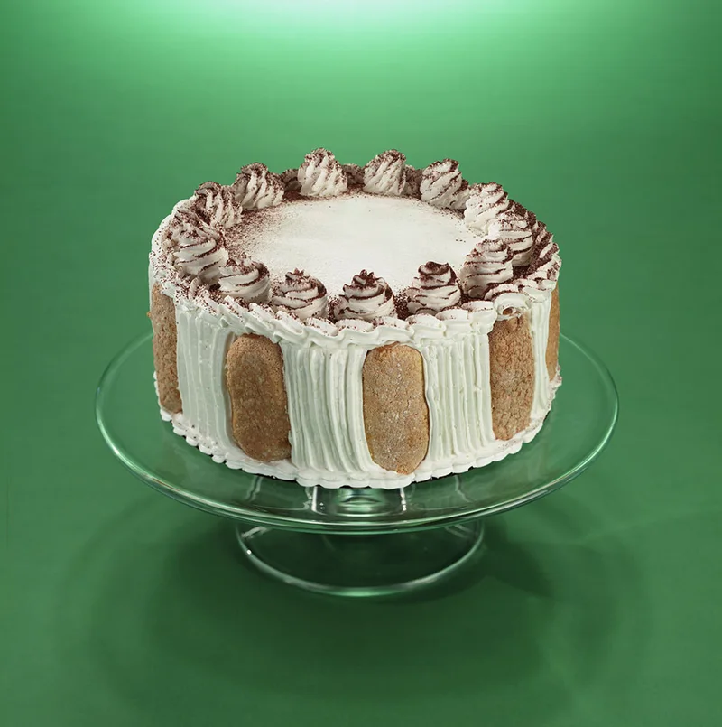 Cake surrounded by lady finger cookies