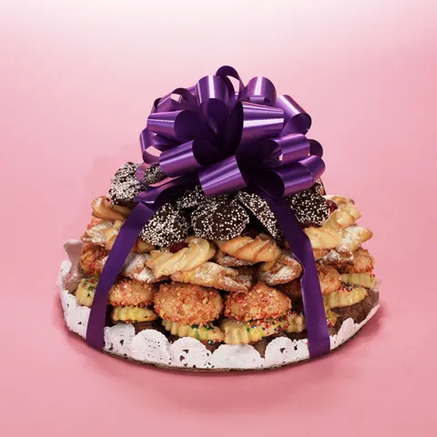 A tower of Italian cookies tied with a purple bow